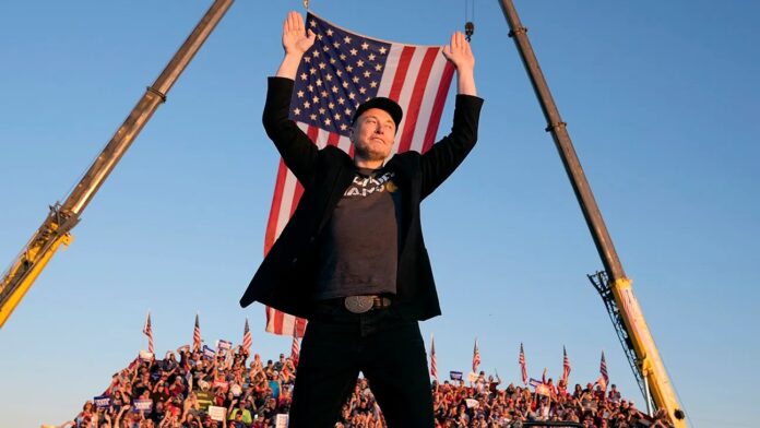 114127-MUSK_-_Elon_Musk__Official_still_-H-2026